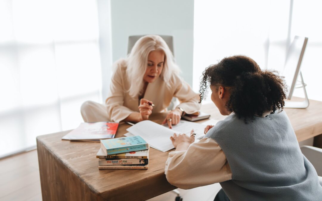 Tutor works with young student
